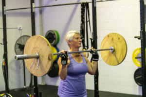 Old Women Lifting Weight